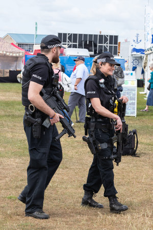 09/14/2019 Portsmouth, Hampshire, UK Armed British police officers policing an outdoor event male and femaleのeditorial素材