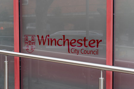 11/06/2019 Winchester, Hampshire, UK the sign of Winchester city council on the council buildingのeditorial素材