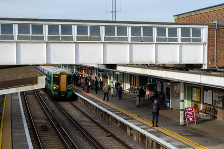 02/05/2020 Chichester, West sussex, UK Train passengers waiting on a railway station platform while...
