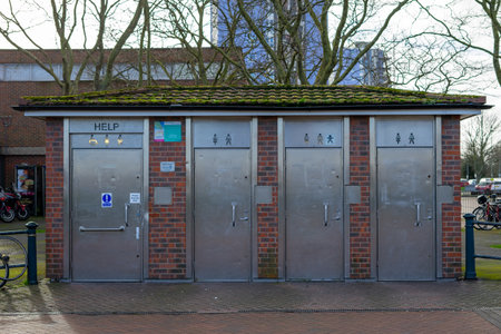 01/29/2020 Gosport, Hampshire, UK old run down public toilets with metal doorsのeditorial素材