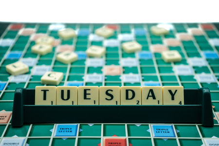 02/09/2020 Portsmouth, Hampshire, UK the word Tuesday spelled out on scrabble tiles on a scrabble boardのeditorial素材