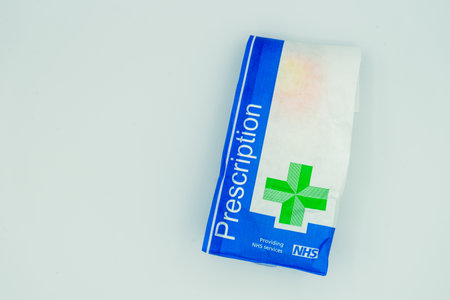 02/15/2020 Portsmouth, Hampshire, UK A British NHS prescription paper bag isolated on a white backgroundのeditorial素材
