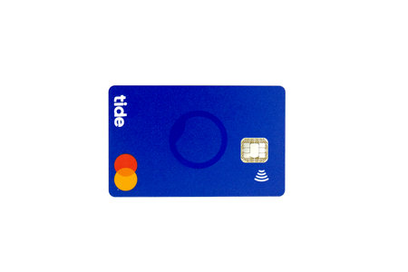 03/04/2020 Portsmouth, Hampshire, UK A Tide bank Debit card Mastercard isolated on a white backgroundのeditorial素材