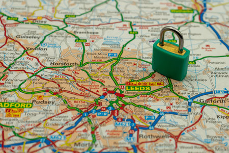 03/18/2020 Portsmouth, Hampshire, UK Leeds UK Shown on a road map or geography map with a padlock on top to represent a city in lock downのeditorial素材