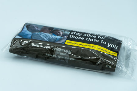 04/23/2020 Portsmouth, Hampshire, UK An unopened Pouch Amber leaf of rolling tobacco isolated on a...