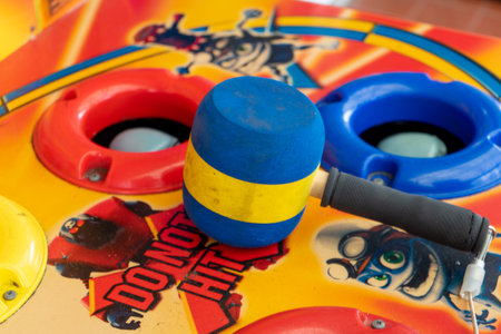 10/30/2019 Portsmouth, Hampshire, UK A whack a mole hammer on a game at the funfairのeditorial素材