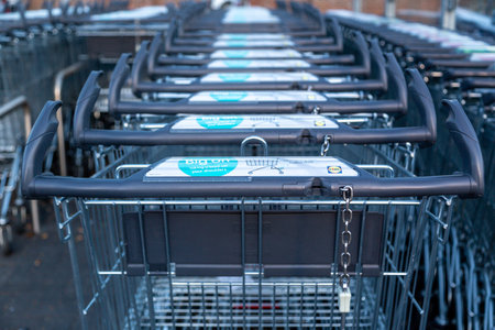 08/02/2020 Portsmouth, Hampshire, UK a row of Lidl supermarket shopping trolleys in a trolley parkのeditorial素材