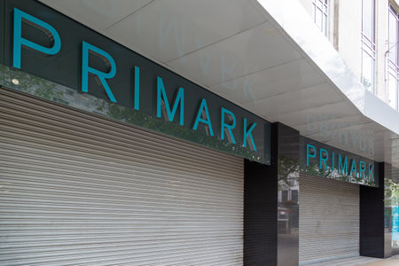 a Primark store with closed shutters on a high streetのeditorial素材