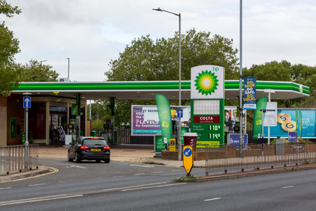 The exterior of a BP petrol station or gas station with a car entering the forecourt