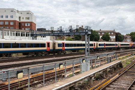 07/31/2019 Portsmouth, Hampshire, UK A british train on railway tracksのeditorial素材