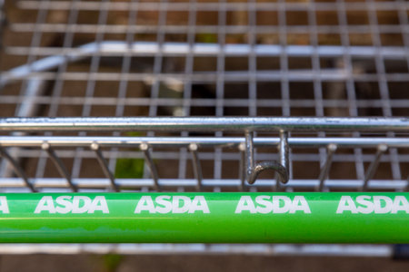 09/29/2020 Portsmouth, Hampshire, UK A close up of the handle of an ASDA shopping trolleyのeditorial素材