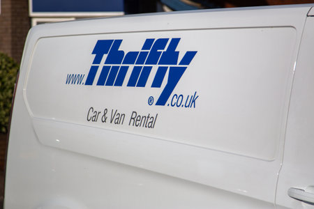 08/30/2020 Hambledon, Hampshire, UK the side of a van showing the thrifty van logo, a car rental companyのeditorial素材