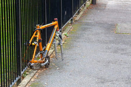 09/29/2020 Portsmouth, Hampshire, UK A bike locked to a metal fence that has had its wheels and saddle stolenのeditorial素材