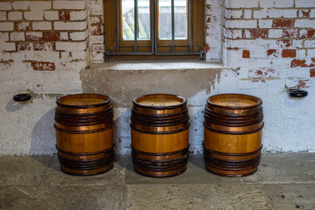 three old barrels used to transport rum in a rowの写真素材