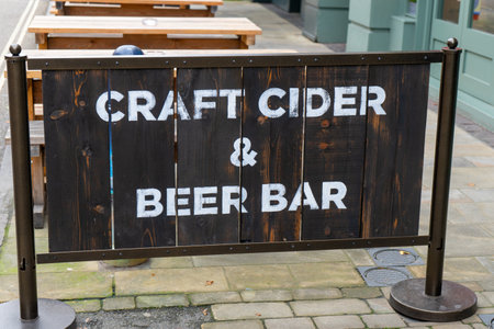 A wooden sign reading Craft cider and beer barの写真素材