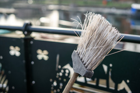 A close up of the head of a roadsweepers broom or brush with selective focus on the bristlesの写真素材