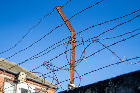 a old rusty barbed wire fenceの写真素材