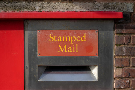 A postbox with the words stamped mail above itの写真素材