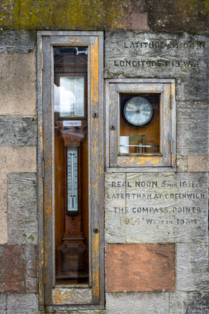 A weather station in the side of an old building in winchester, hampshireの写真素材