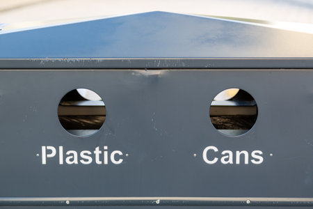 a bin with recycling holes showing cans and plasticの写真素材