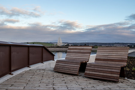 Empty wooden benches at a beauty spotの写真素材