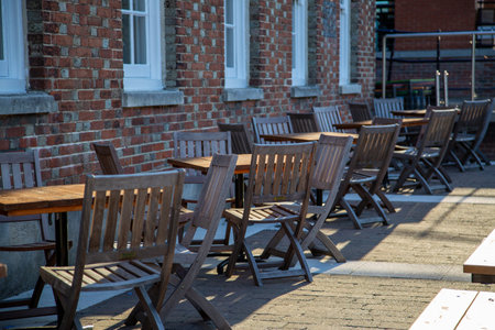 Empty outdoor tables and chairs outside a pubの写真素材
