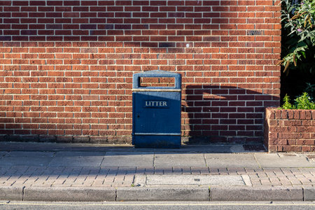 a litter or rubbish bin on an english streetの写真素材