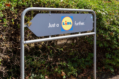 a lidl sign directing cars to the store reading just a Lidl furtherのeditorial素材