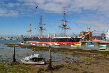 UK HMS Warrior In Portsmouth Harbour at Low tideの写真素材