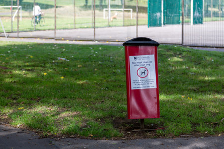 A dog waste bin in the middle of a parkの写真素材