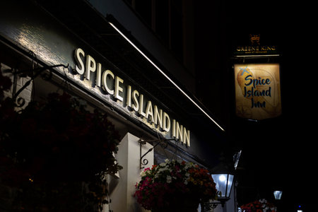 The sign of the The Spice island inn old Portsmouth at nightのeditorial素材