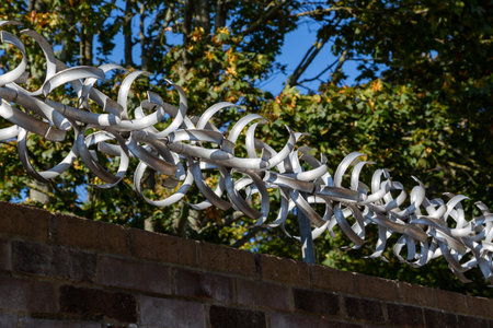 Anti climbing device on the top of a brick wallの写真素材
