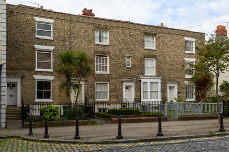 A row of Victorian terraced houses in old commercial road in Portsmouth with cobbled streets, the street that Charles Dickens was born onのeditorial素材