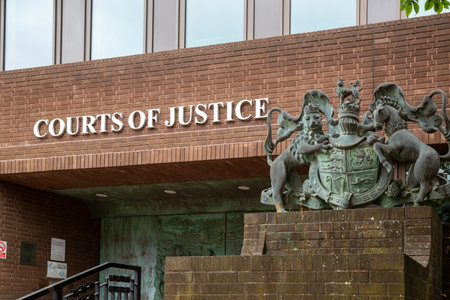 the sign of a courts of justice or magistrates court with the royal crest next to the signのeditorial素材