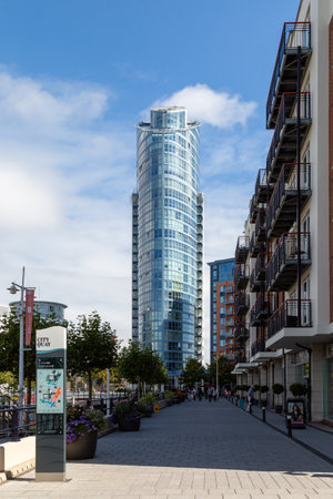 09/08/2020 Portsmouth, Hampshire, UK East side plaza or the lipstick tower in Gunwharf quays in Portsmouth with shoppers walking in the foregroundのeditorial素材