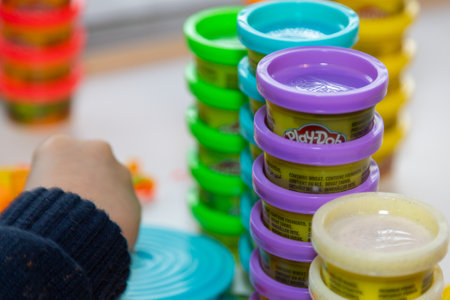01-30-2021 Portsmouth, Hampshire, UK A child playing with Play Doh modelling clay at a tableのeditorial素材