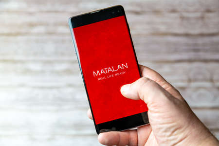 02-05-2021 Portsmouth, Hampshire, UK A Mobile phone or cell phone being held showing the Matalan app open on screenのeditorial素材