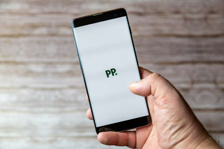 02-05-2021 Portsmouth, Hampshire, UK A Mobile phone or cell phone being held showing the Paddy Power betting app open on screenのeditorial素材