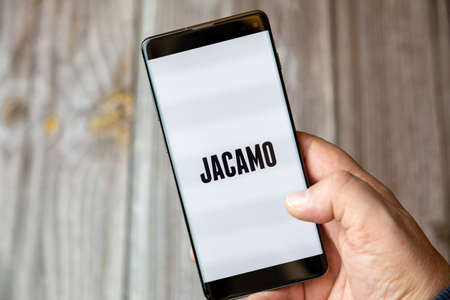 02-10-2021 Portsmouth, hampshire, UK A mobile phone or cell phone being held by a hand with the Jacamo shopping app open on screenのeditorial素材