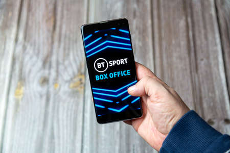 03-10-2021 Portsmouth, Hampshire, UK A Mobile phone or cell phone being held in a hand with the BT...