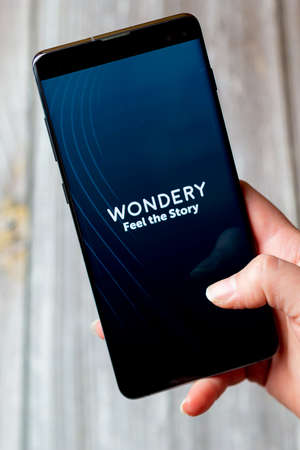 03-22-2021 Portsmouth, Hampshire, UK A mobile phone or cell phone being held in a hand with the...