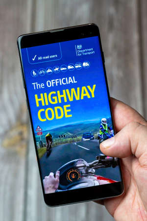 03-10-2021 Portsmouth, Hampshire, UK A Mobile phone or cell phone being held in a hand with the...