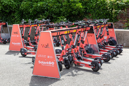 07-07-2021 Portsmouth, Hampshire, UK A Voi e-Scooter parking station filled with scooters for hireのeditorial素材