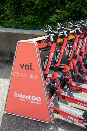 07-07-2021 Portsmouth, Hampshire, UK A Voi e-Scooter parking station filled with scooters for hireのeditorial素材