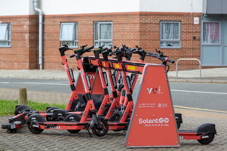 08-04-2021 Portsmouth, Hampshire, UK Voi e-scooters or Electric scooter at a scooter park ready to be hiredのeditorial素材