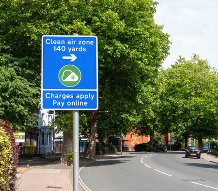 07-25-2022 Portsmouth, Hampshire, UK, A road sign showing that cars are entering a clean air zone and that charges applyのeditorial素材