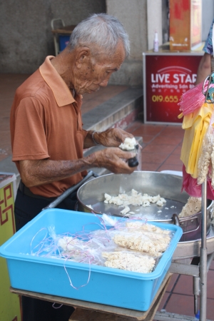 Man selling candy on streetのeditorial素材