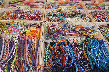 St AYGULF, VAR, PROVENCE, FRANCE: Provencal market stall selling beads, armbands and other items in...