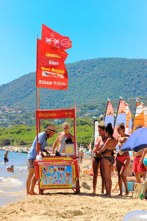 LA CROIX VALMER, PROVENCE, FRANCE - AUGUST 23 2016: Beach vendor selling Ice cream, donuts (beignet) and snacks on the beach at La Croix Valmer, on the French Rivieraのeditorial素材