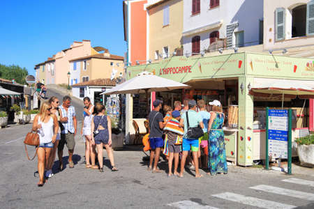 PORT GRIMAUD, PROVENCE, FRANCE - AUGUST 23 2016: Holiday makers queue for Ice Cream while on vacation in this pretty French Riviera village built on the shore of the Mediterraneanのeditorial素材
